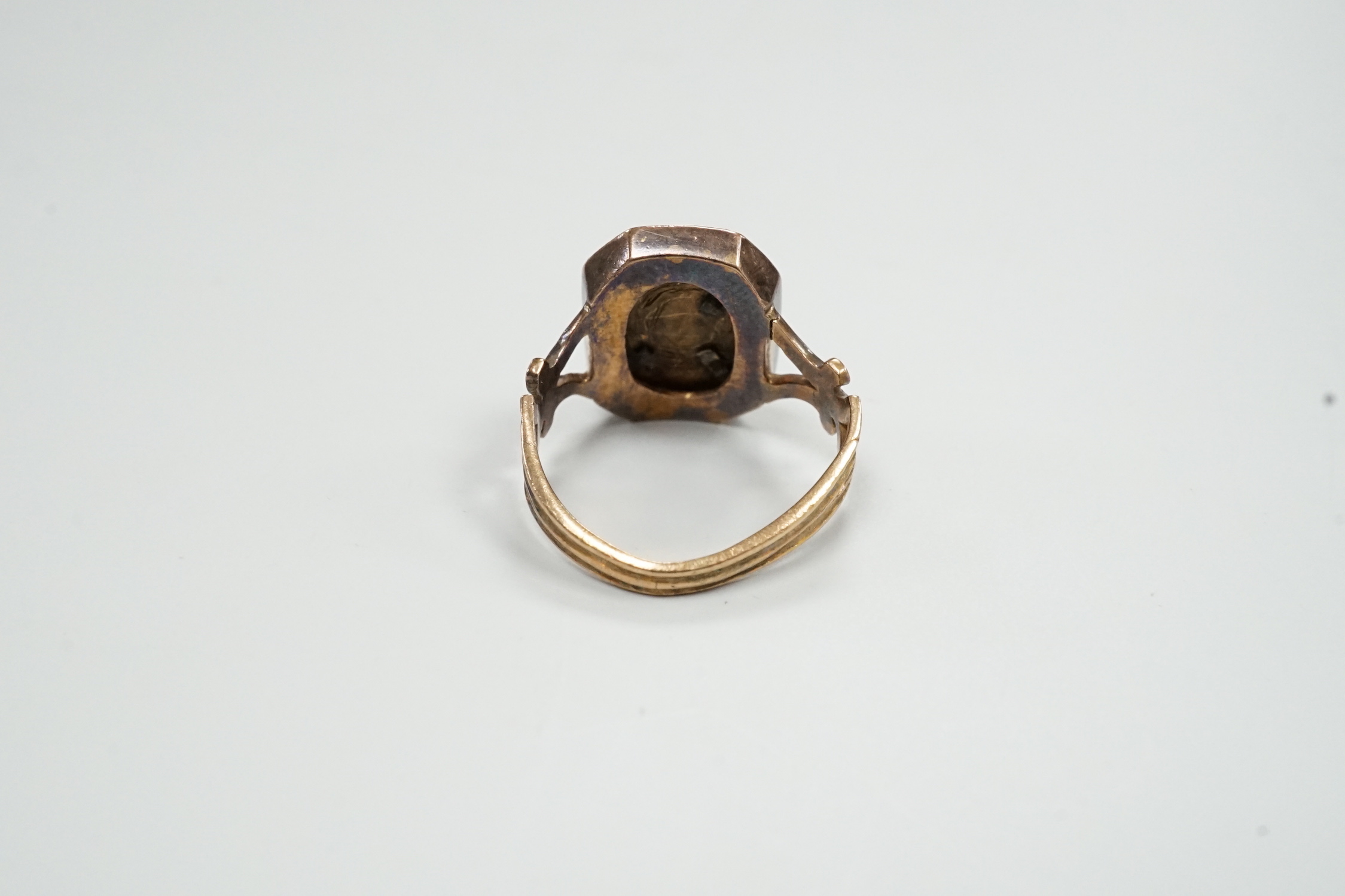 A 19th century yellow metal (stamped 18), enamel and rose cut diamond set initial ring, size H/I, gross weight 4.9 grams.